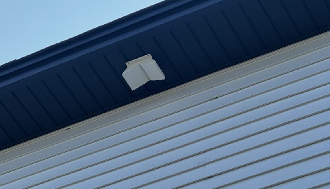 Close up of newly installed soffit dryer vent termination